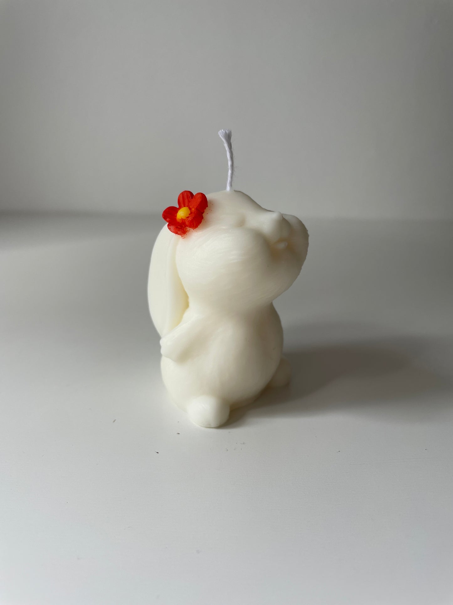 Vela conejo flor naranja
